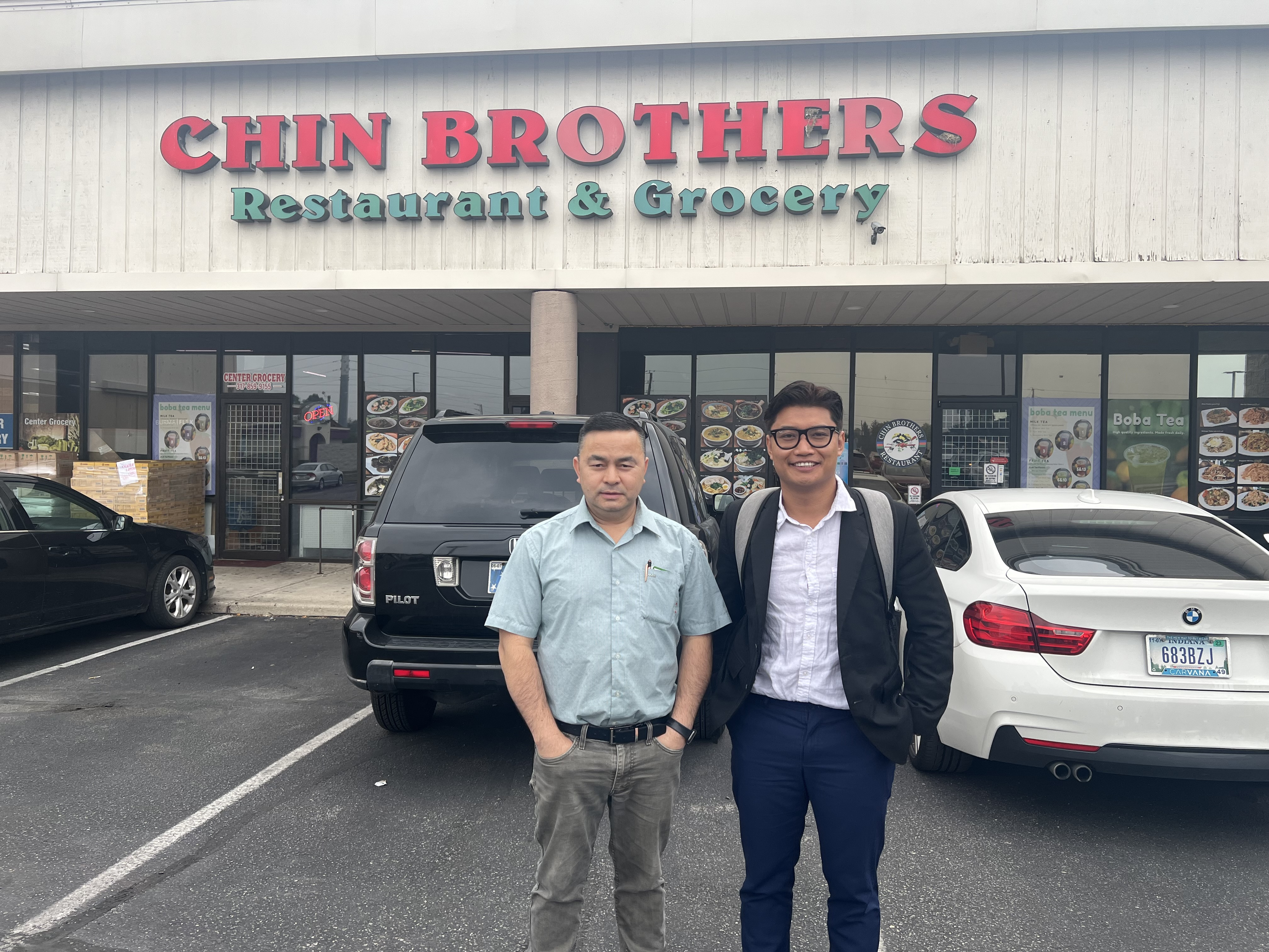 Left: Than Hre, the owner of Chin Brothers Restaurant and Grocery. Right, the author after a conversation with Than Hre.