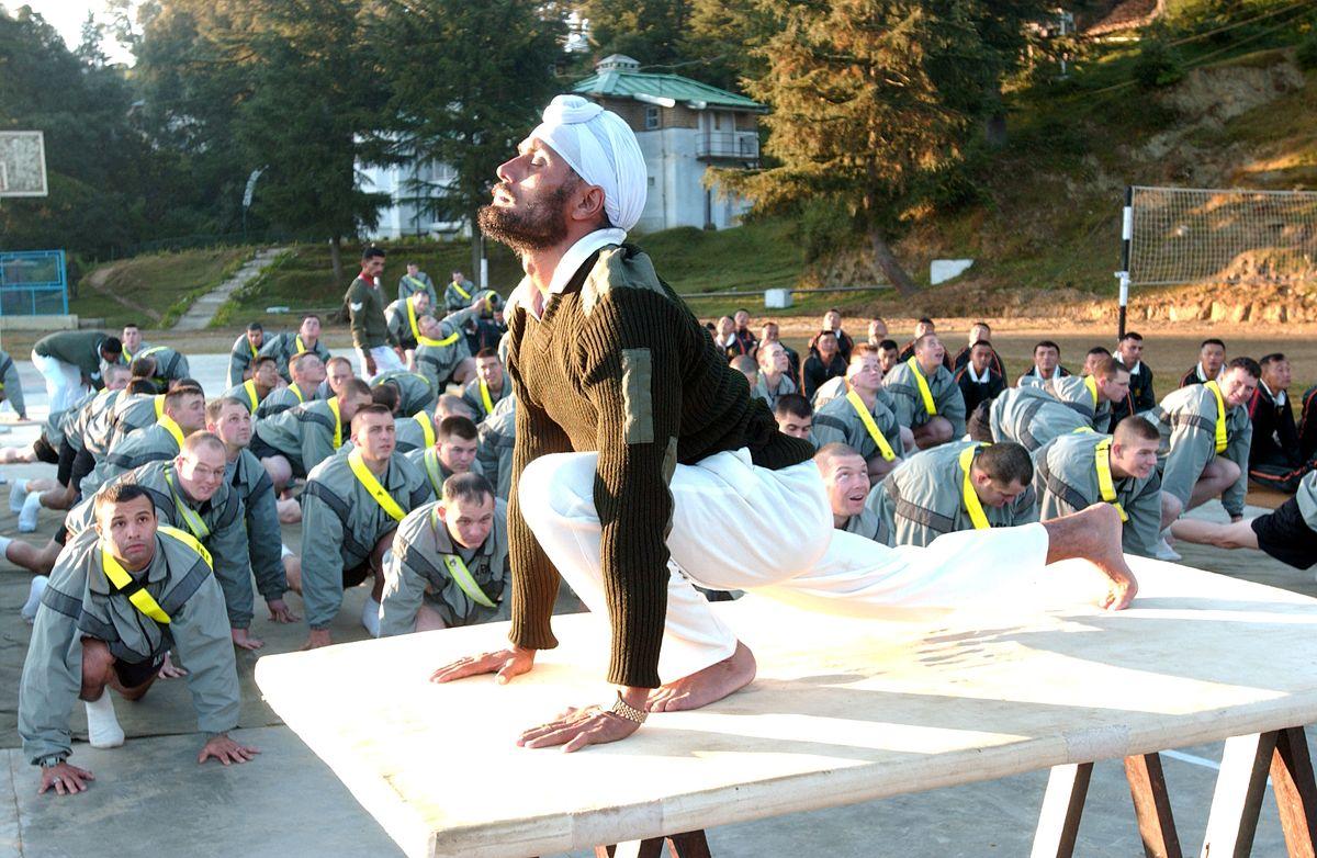 Sgt. Gurdev Singh leads US Soldiers in Yoga Exercise.