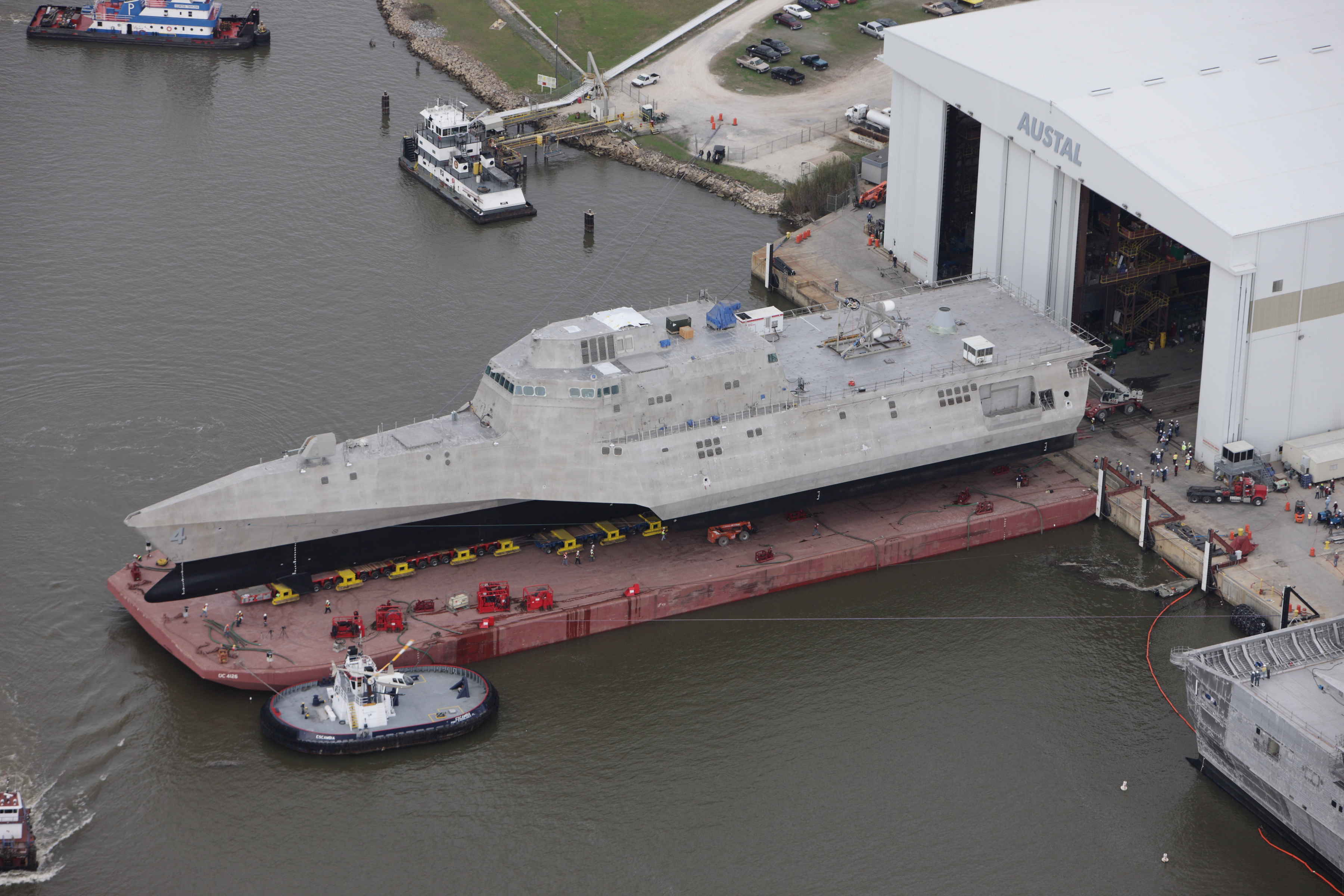 A Littoral Combat Ship, the USS Coronado (LCS-4) being rolled out of the assembly bay at Austal USA’s shipyard in Mobile, Alabama [Image: US Navy]